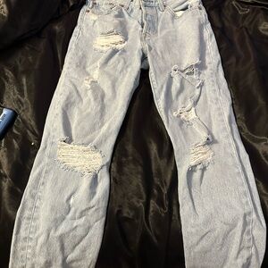 Woman’s Light Blue Distressed Jeans